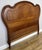 An elegant Antique French headboard in walnut, featuring a beautifully sweeping curved silhouette, warm natural finish and...