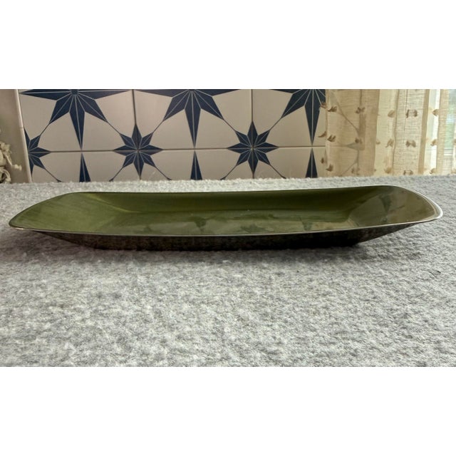 Add a true icon of mid-century Scandinavian modernism to your collection. This authentic vintage 11x5 rectangular enamel...