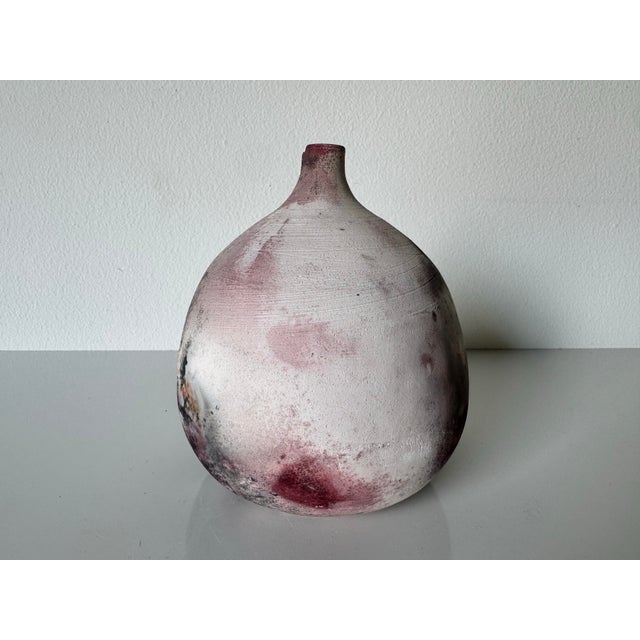 A striking vintage raku pottery vase, handcrafted by Nason. This uniquely shaped vessel features an organic, bulbous form...
