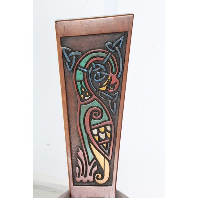 Bench: 34" tall; 27.5" wide; 19.5" deep (front to back edge) Seat height: 17." Rich with traditional Celtic motifs, this...