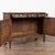 19th-century French oak sideboard buffet showcasing a deep, dark patina developed over generations of use. The façade...