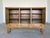 highly architectural Danish Brutalist highboard in solid oak, dating to the 1960s. This piece is a quintessential example...
