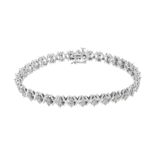 Elegant and timeless, this gorgeous sterling silver link bracelet features 1.0 carat total weight of round, rose cut,...