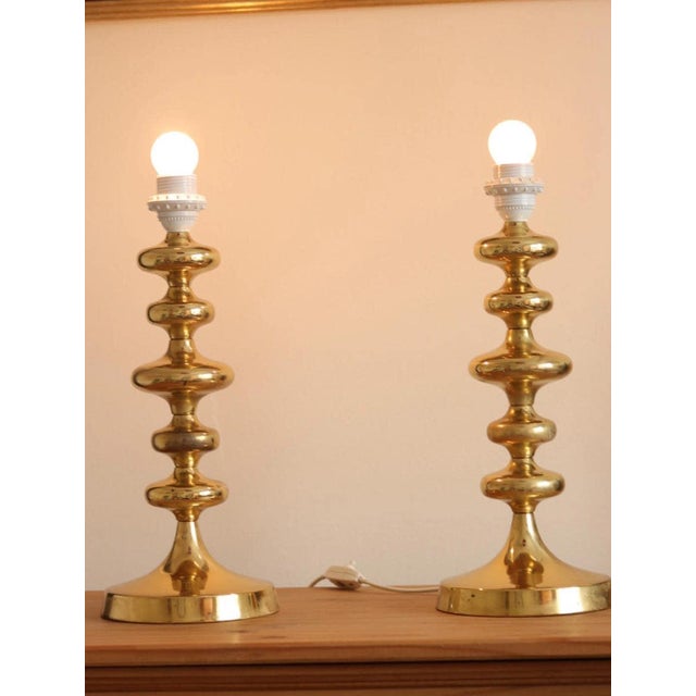 Made in sweden pair of swedish brass bobbin table lamp ia, type 1705. two exquisite polished brass table lamps featuring a...