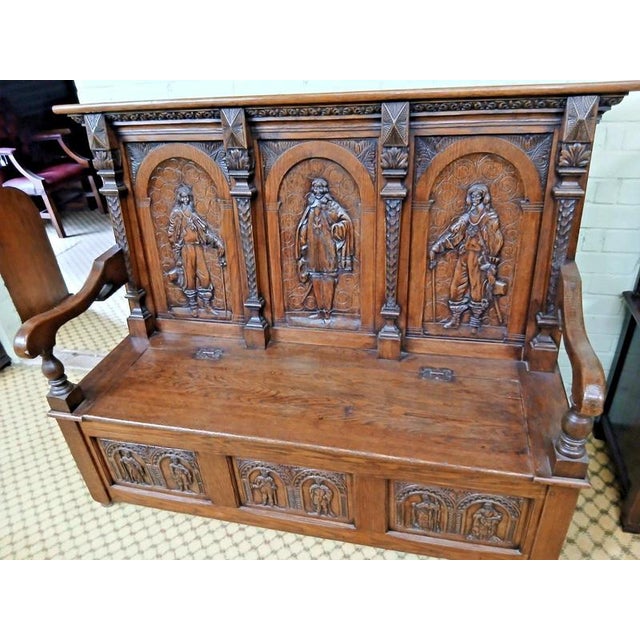 19th Century Victorian Carved Oak Settle Material: Oak An impressive 19th-century Victorian settle, substantially...