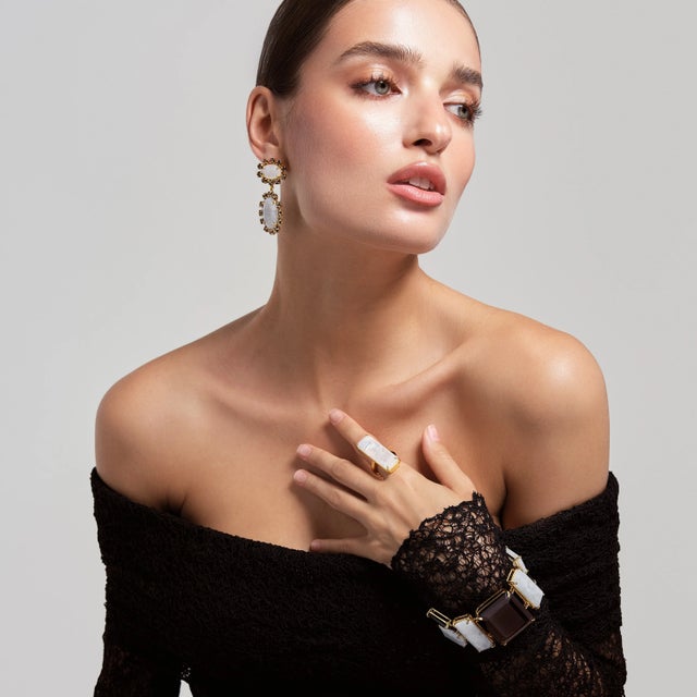 Add an extra touch of sophistication to your ensemble with our Lucille Rectangle Ring. This ring is a masterful blend of...