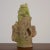 An abstract glazed ceramic sculpture by Stan Bitters, c. 2006, USA. This piece features a ribbed green form at the top of...