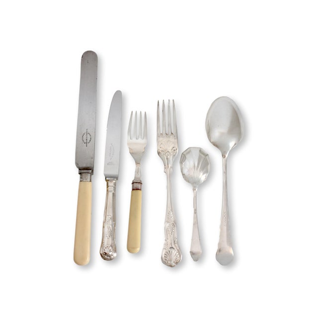 A striking mixed English flatware service for 8, featuring an eclectic blend of antique and vintage pieces with...