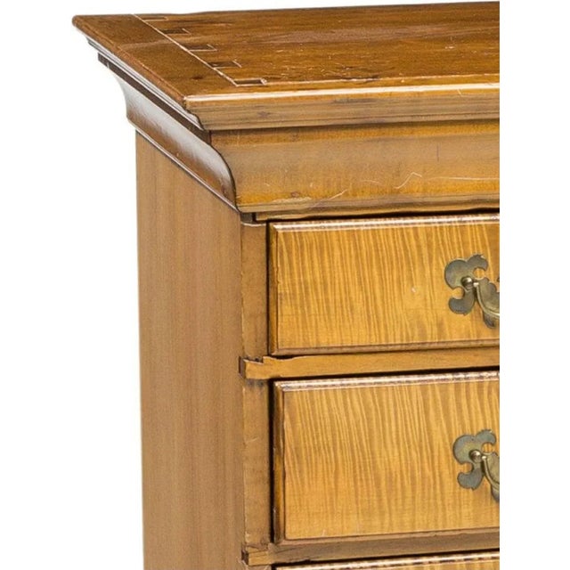 An antique American Chippendale style curly maple (also called tiger or figured maple) chest on stand from the 19th...