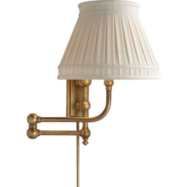 Pimlico Swing Arm in Antique-Burnished Brass with Linen Shade Designer: Chapman & Myers Finish: Antique-Burnished Brass...