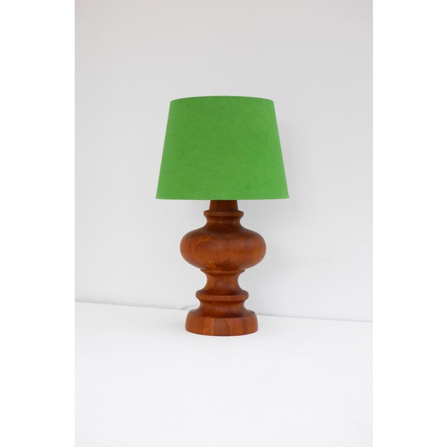 A voluptuous mid-century modern scandinavian dark oak lamp, crafted in the 1960s by möllers armatur, eskilstuna, sweden....