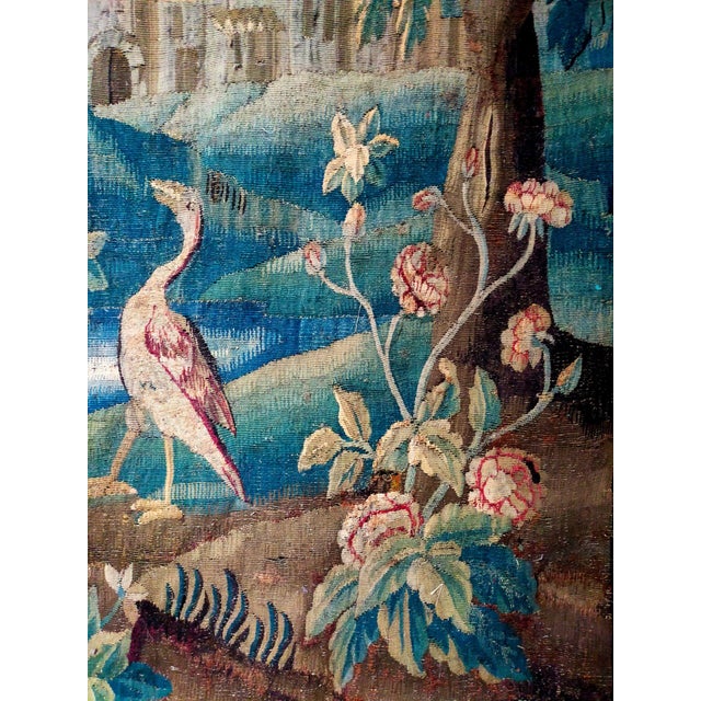 Aubusson (France) wool tapestry depicting greenery enlivened by herons, and a village in an architectural perspective....