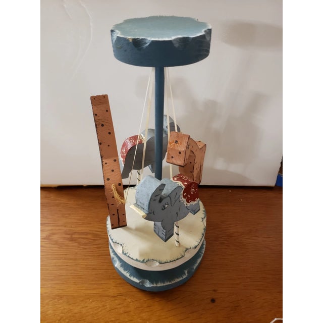 The piece is in very good overall condition with minor wear consistent with its age and use. It spins back and forth when...