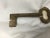 Antique English Cast Iron Key. Measures 6" X 1 1/2" X 1/4"