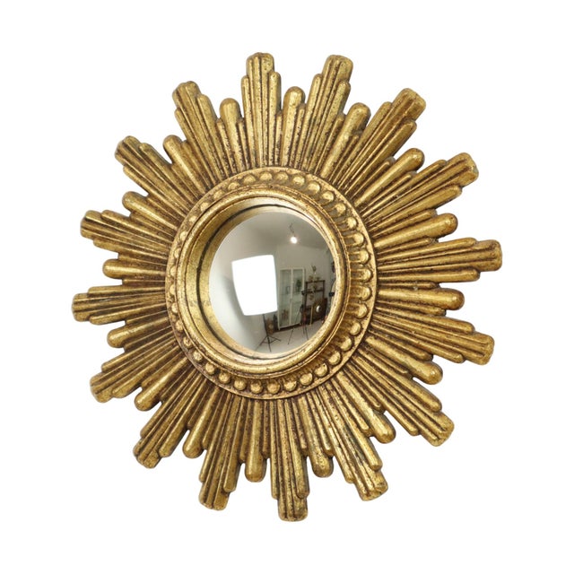 Small vintage sunburst mirror made of gold-colored polyresin, a type of hard plastic, typical of a mirror from Italy from...