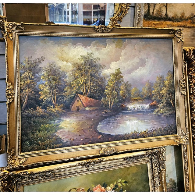 Bring the peaceful beauty of the countryside into your home with this charming landscape painting depicting a tranquil...