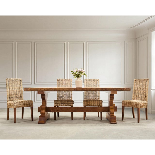 A beautifully crafted trestle dining table constructed from oak in a rustic country French Provincial style measuring over...