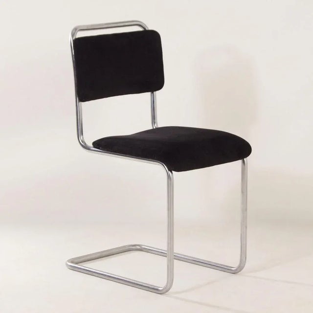 Original gispen 101 tubular chair designed by w.h. Gispen in the 1930s. We have reupholstered this chair with new black...