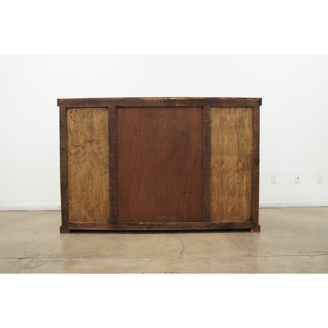 This rustic Western-style dresser cabinet is a bold, statement-making piece defined by its rich wood tones, substantial...