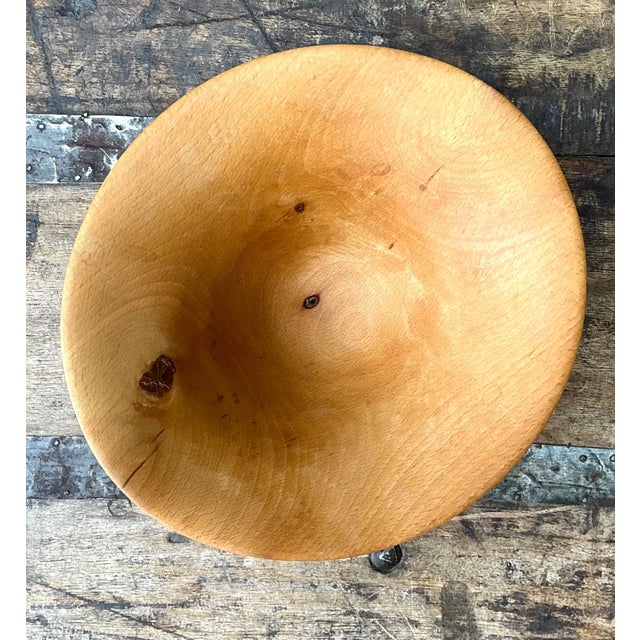 This signed wood bowl from Nova Scotia, dated 1994, is a refined example of late 20th-century studio craftsmanship....