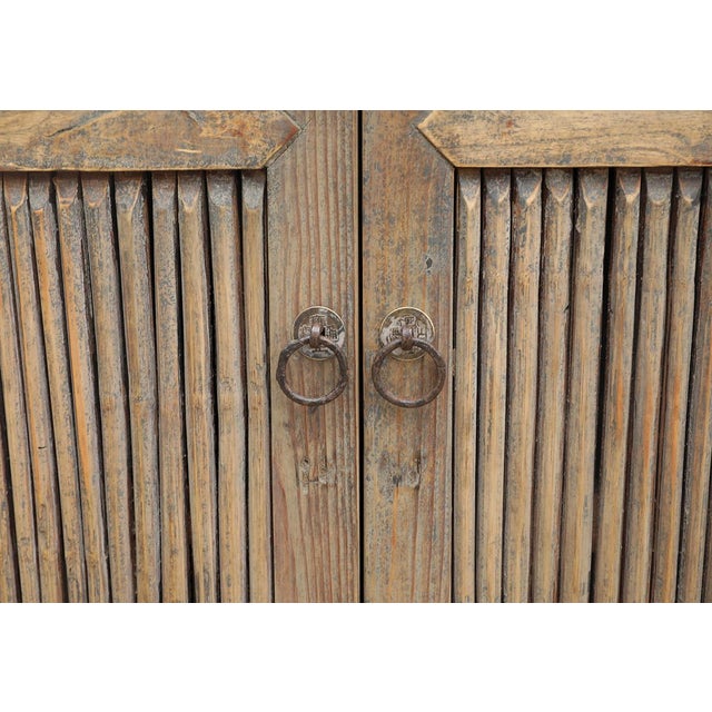 Antique Chinese Pine and Bamboo "Kitchen" Armoire, late Qing Dynasty, c. 1900-20. The pine frame and side door panels are...