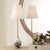Gloss White Glass Featuring Metallic Smoked Bronze Hues Accented With Antique Brass Plated Details. A Tapered Round...