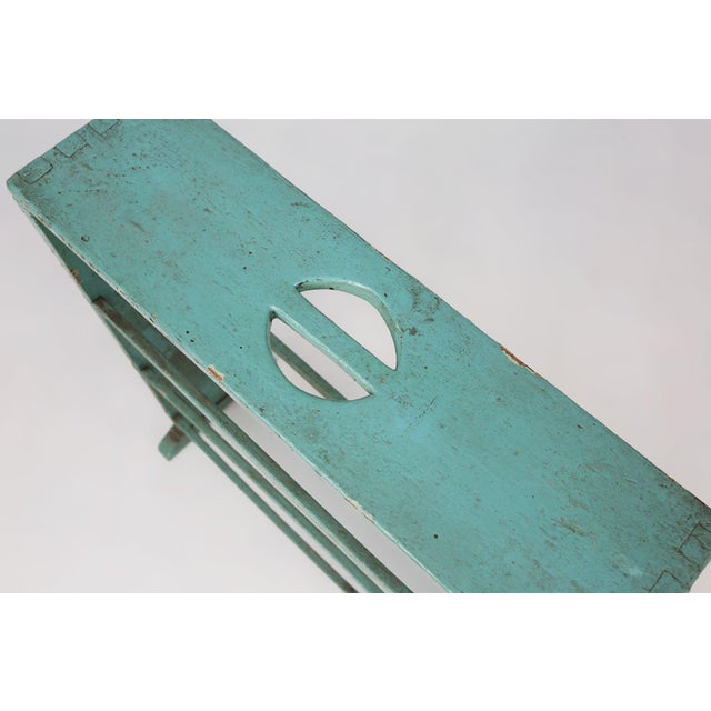 This compact industrial rack from 1920s Belgium carries the unmistakable charm of early utilitarian design, where function...