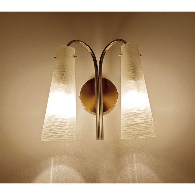 Vintage Mid century sconce from the 1950s , brass structure with cylindrical opaline glass shade Very good condition...