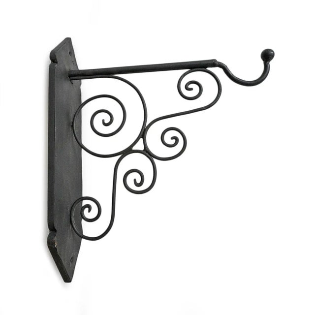 Beautiful hand crafted iron scroll design vintage wall bracket with blackened finish. Perfect for hanging lights or plants...