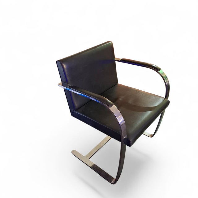 Introducing the "BRNO" chair, designed by the iconic Mies van der Rohe in the 1960s. This chair perfectly combines leather...