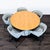 This Blu Dot dining set includes a stylish round wooden table with a sturdy white metal base and five comfortable...