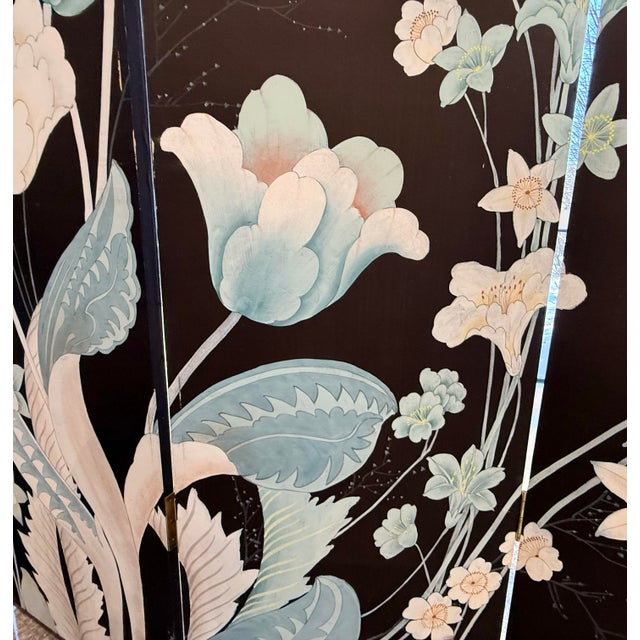 Hand-painted chinoiserie four-panel room divider in rich black lacquer, featuring graceful blossoms and foliage in soft...