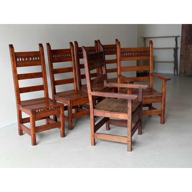 This is a set of six handmade studio craft dining chairs with peg construction circa 1970. The set has a Southwest or...