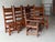 This is a set of six handmade studio craft dining chairs with peg construction circa 1970. The set has a Southwest or...