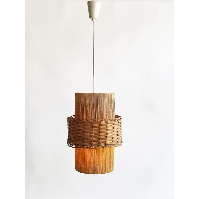 Lovely, minimalist mid-century pendant light from the 1960s, attributed to Temde Leuchten Switzerland / Germany. Made of...