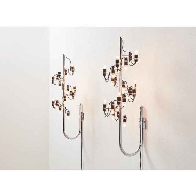 Early pair of model 226 wall lamp, designed by Gino Sarfatti in 1959 for Arteluce Italy. The lamps are marked with the...