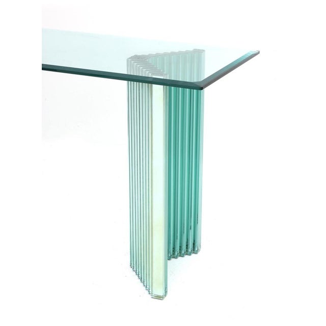 A beautiful console by Luigi Massoni with two mirrored glass columns and a rectangular glass table top with bevelled...