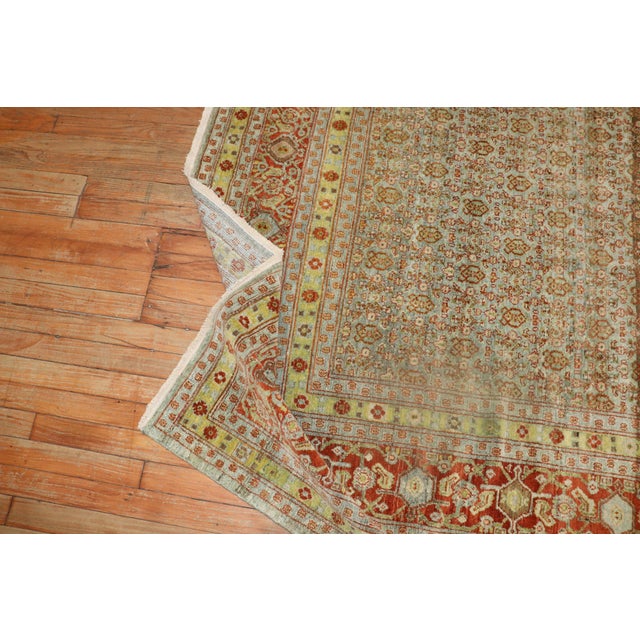 an early 20th-century Square size Persian senneh rug featuring a striated all-over traditional herati design. Measures:...