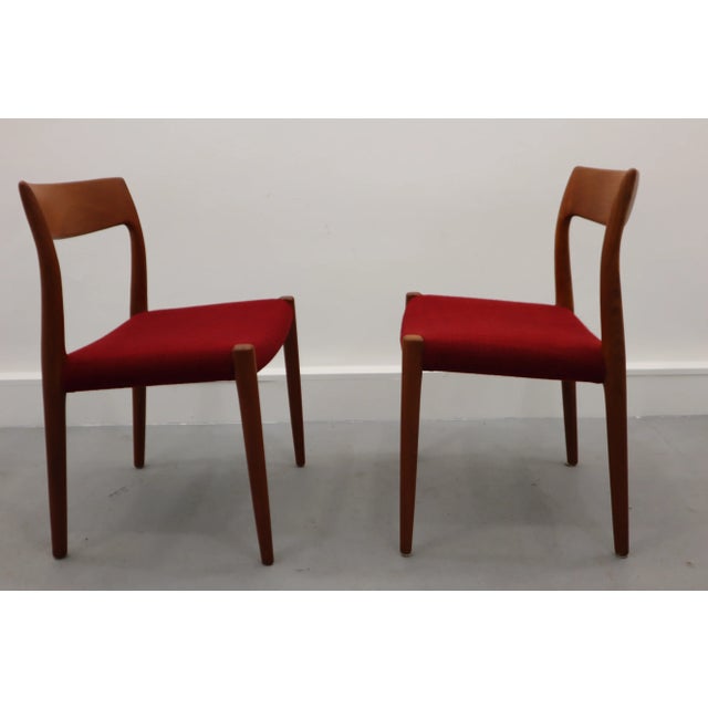 2 Chairs from the Danish designer Niels Otto Moller. Chair frame of teak wood. Seat upholstery of red wool. Very good...
