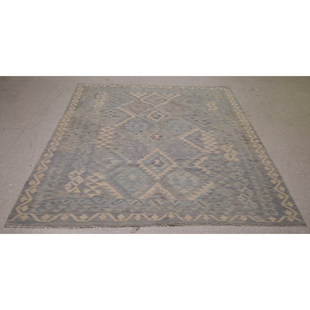 Vintage Afghan Maimana hand woven kilim with natural colors, undyed wool and geometric pattern.