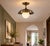 Crafted from solid brass, this pendant light features a gracefully curved dome shade paired with a softly illuminated opal...