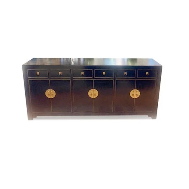 Asian East Village Sideboard is made out of Asian elm wood. It has 6 drawers and 6 doors with 1 removable shelf on each...