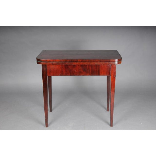 This is an antique mahogany console table in the Edwardian style that can be converted into a gaming table. Beautiful...