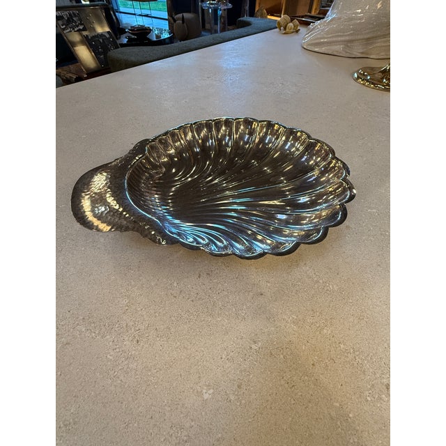 Italian decorative centerpiece bowl from the 1970s, designed in the form of an elegant shell with radiating fluted ribs...
