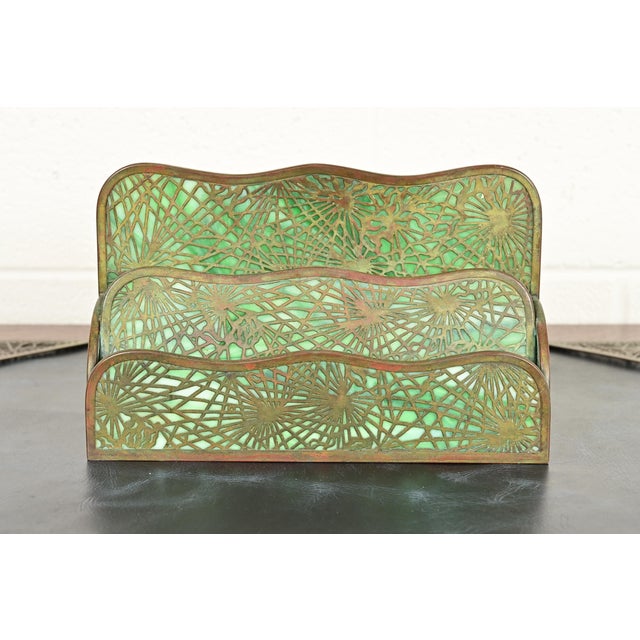 A gorgeous antique Arts & Crafts or Art Deco period bronze and Favrile slag glass "Pine Needle" pattern desk letter holder...