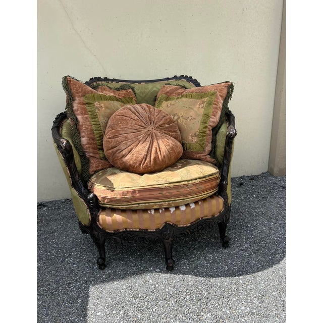 Stunning carved walnut french victorian pink, green silk blend upholstery . Item features ornate floral carvings to the...