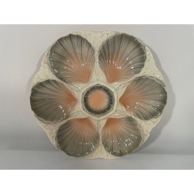 A stunning hand crafted ceramic Majolica Sarreguemines Oyster Plate made in northern France. Circa 1920s. Maker's marks...