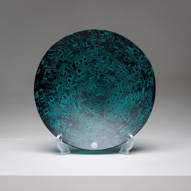 The Murrine Glass Plate by Santillana for Venini, Italy 1997, is a stunning example of contemporary glass artistry....