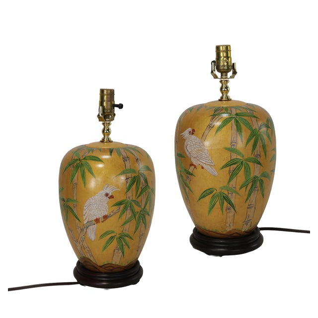 These lamps exude exotic charm and timeless appeal, featuring a classic ceramic ginger jar design with a warm, rich gilded...