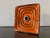 This square wall lamp is an original piece from the Pop Art era of the 1970s. Its striking design, featuring a concentric...